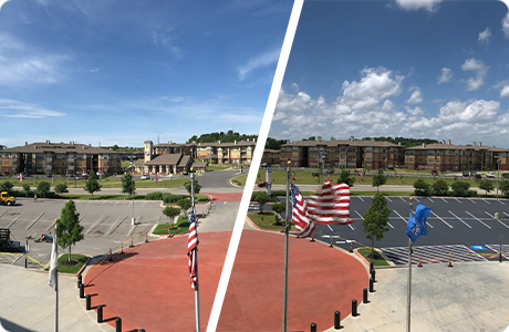 Comparison of before and after crack sealing and asphalt resurfacing for a large parking lot outside residential buildings with American flags in the foreground